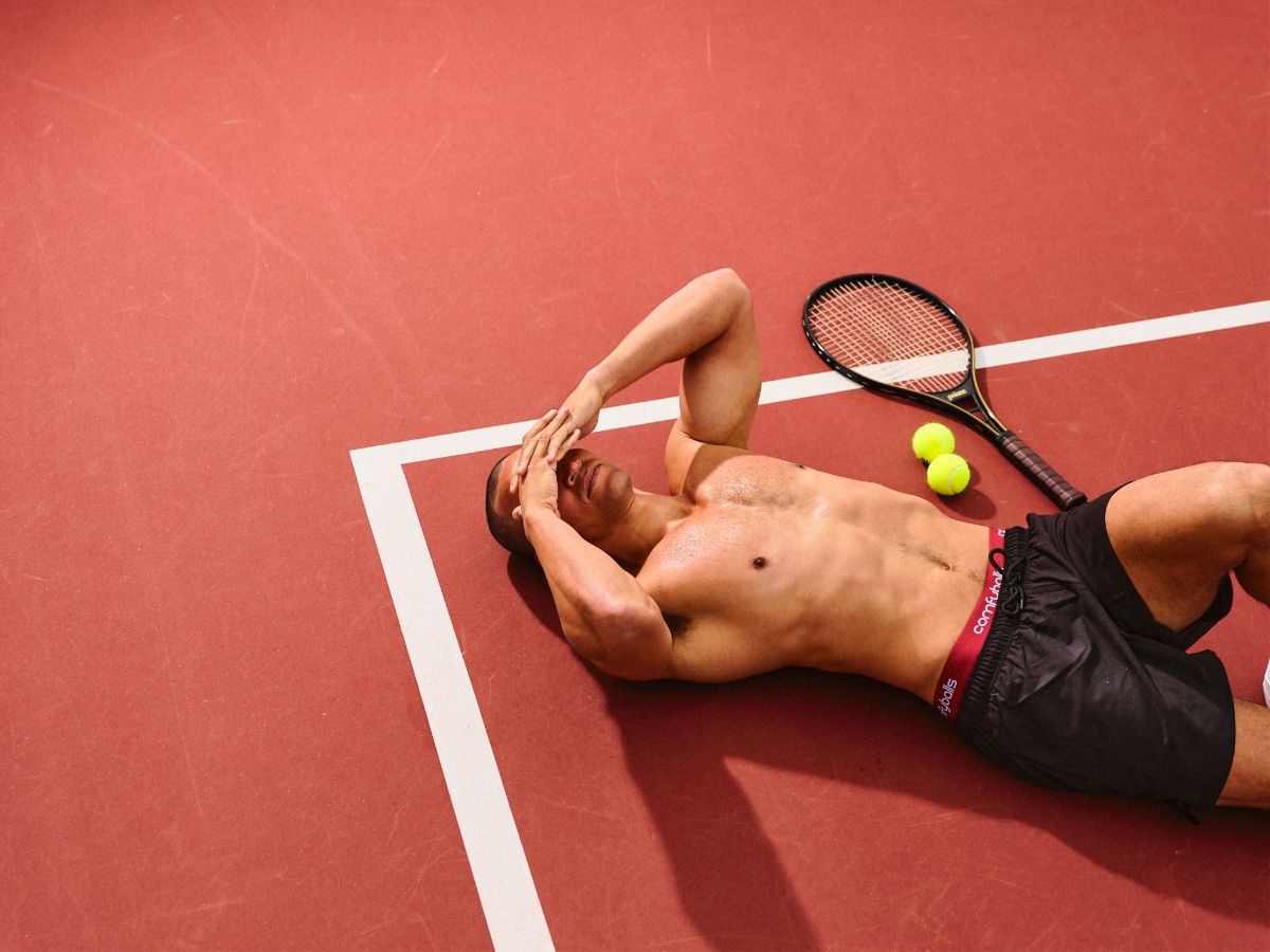 Comfyballs AW26 campaign on a red clay tennis court